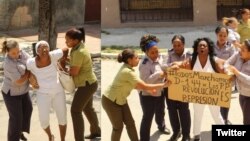 Agentes de la policía política detienen a las Damas de Blanco cuando salen a la calle a manifestarse pacíficamente. 